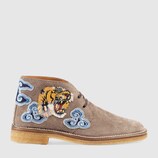 Suede boot with appliqués