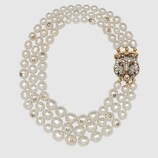 Layered pearl necklace with feline closure
