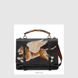 Leather briefcase with tiger