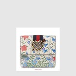 GucciTotem New Flora print leather clutch