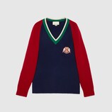 Pull en laine à col en V avec lyre