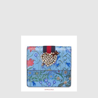 GucciTotem New Flora print leather clutch
