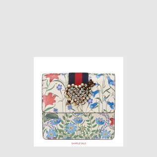GucciTotem New Flora print leather clutch