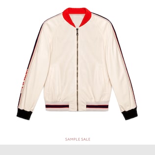 Blouson aviateur en cuir perforé avec logo Gucci