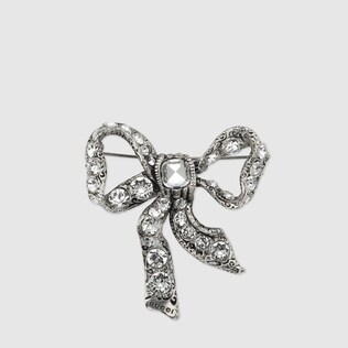 Bow brooch in metal
