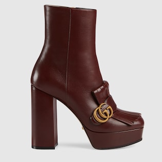 Stivaletto in pelle con plateau e frange
