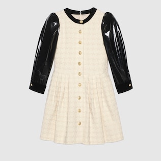 Houndstooth tweed dress with vinyl sleeves