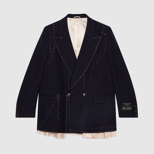 Asymmetric pinstripe jacket with stitching
