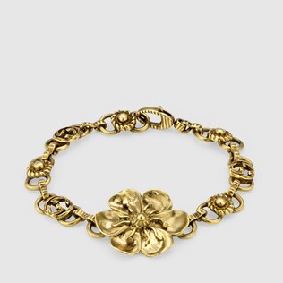Bracelet en métal avec détail fleuri