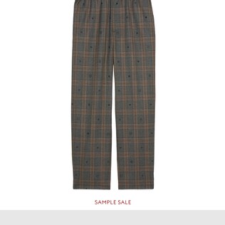 Pantalon en laine à carreaux et symboles