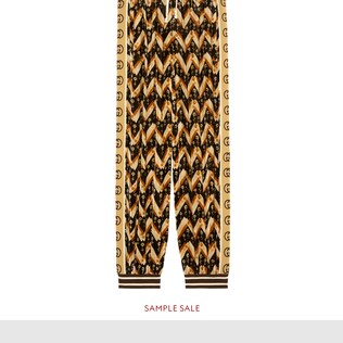 Pantalon sarouel en velours à chevrons motif marguerites