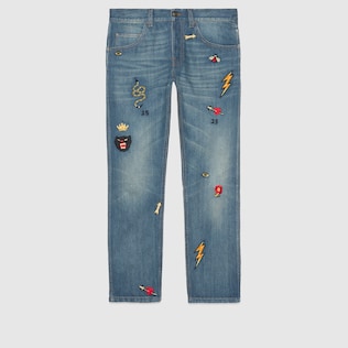 Jeans aderenti con simboli