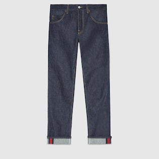 Dunkelblaue Jeans mit abgeschrägtem Bein und Webstreifen