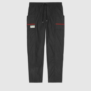 Coated cotton trousers with Gucci label