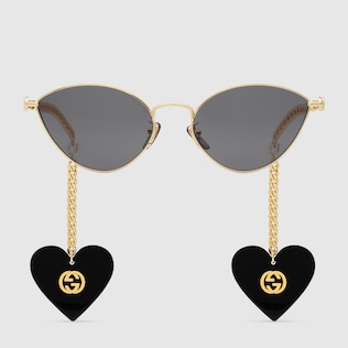 Cat eye sunglasses with heart shaped charms