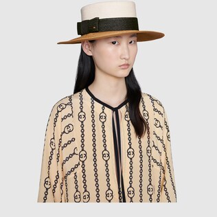 Straw-effect wide brim hat with bow