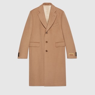 Camel coat with label