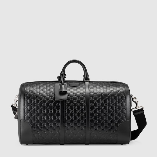 black gucci luggage