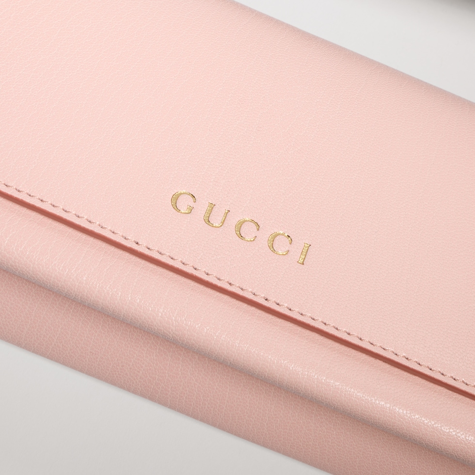 Mini pouch with Gucci lettering