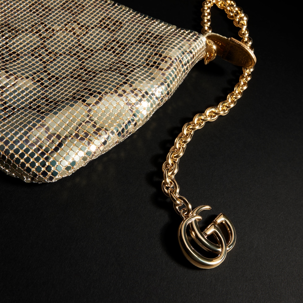 Metallic evening bag with charm