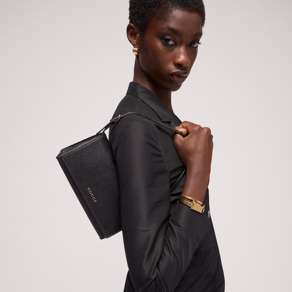 Mini pochette avec lettrage Gucci