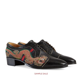 Leather lace-up shoe with dragon