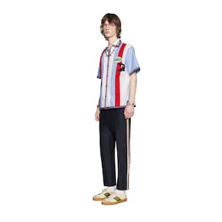 Track bottoms with Gucci stripe