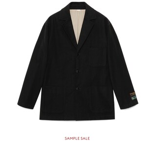 Veste en moleskine noire avec étiquettes