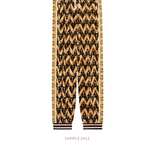 Pantalon sarouel en velours à chevrons motif marguerites