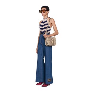 Washed denim flare pant with Gucci label