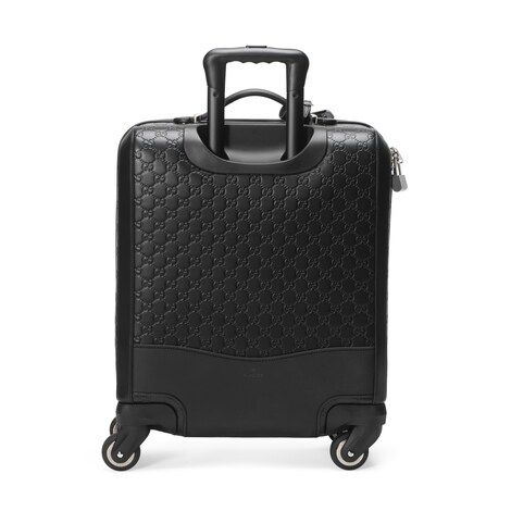 black gucci luggage