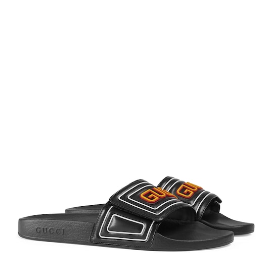 Gucci Men's Gucci logo leather slide sandal. 1 Gucci Men's Gucci logo leather slide sandal. 1