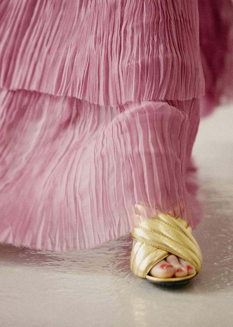 Introducing the season's <strong>crossover</strong> — a high heel <strong>slide</strong> in quilted leather.The Crossover