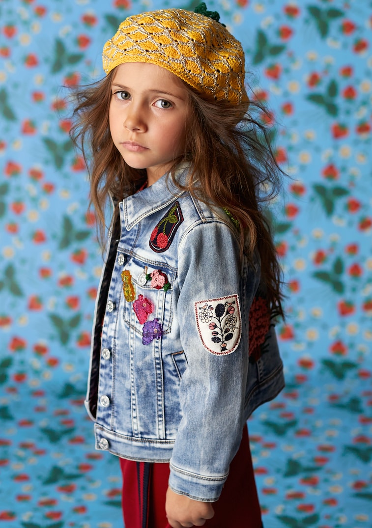 Woven through the new collection, whimsical details of animals and fruit.Gucci Kids