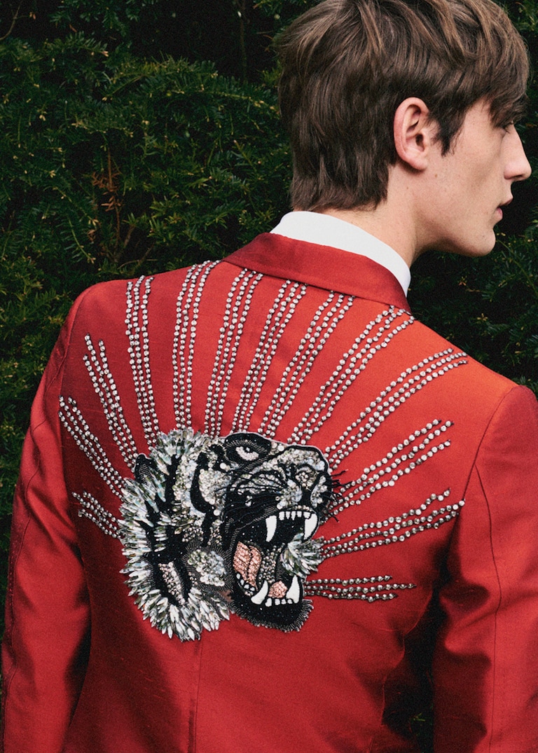 Tuxedos cut from bright silks and embroidered with roaring animals: unordinary men’s eveningwear by Alessandro Michele. The Evening Set