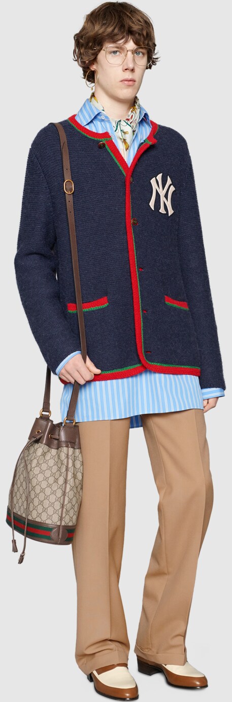 Gucci Official Site Redefining Modern Luxury Fashion A Model Wearing Jacket With Ny Yankees Patch Ophidia Gg Bucket Bag