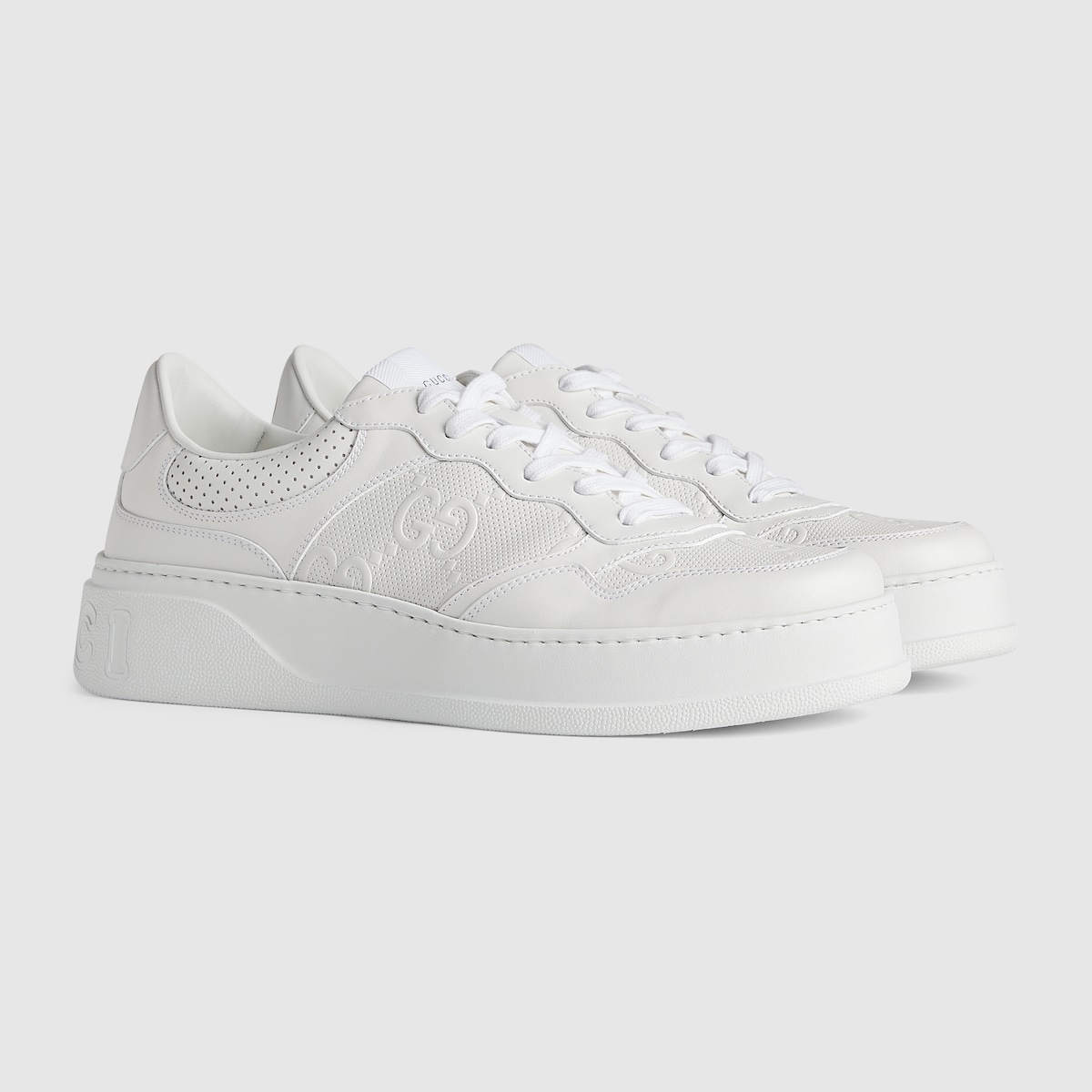 Men s GG embossed trainer in white leather GUCCI SG