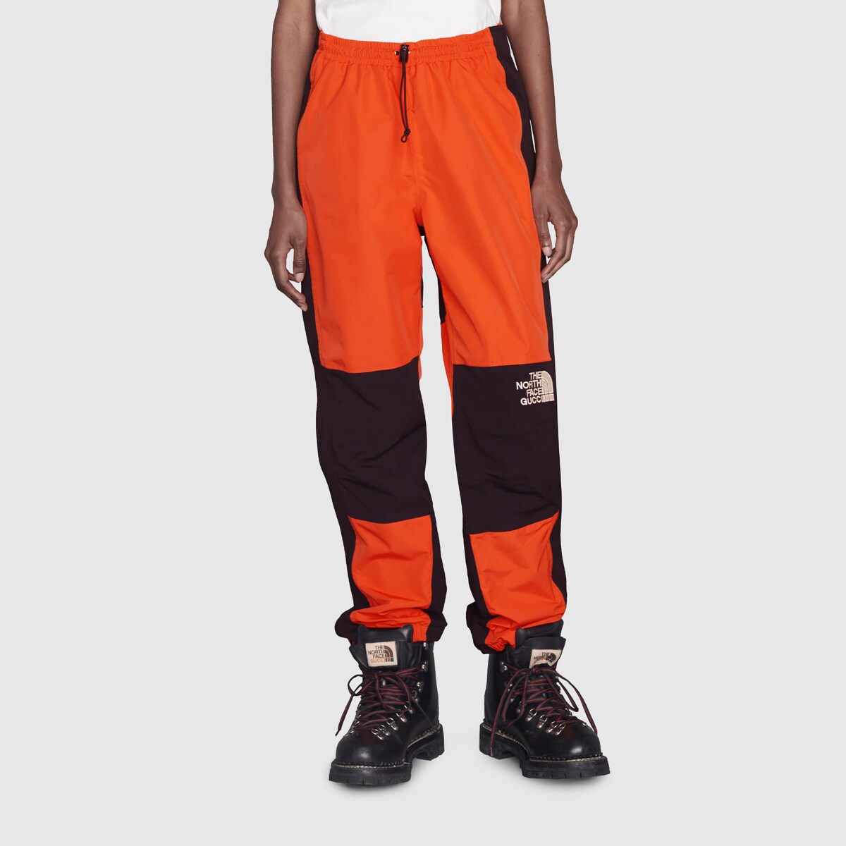 The North Face x Gucci nylon pant in orange and black GUCCI® US