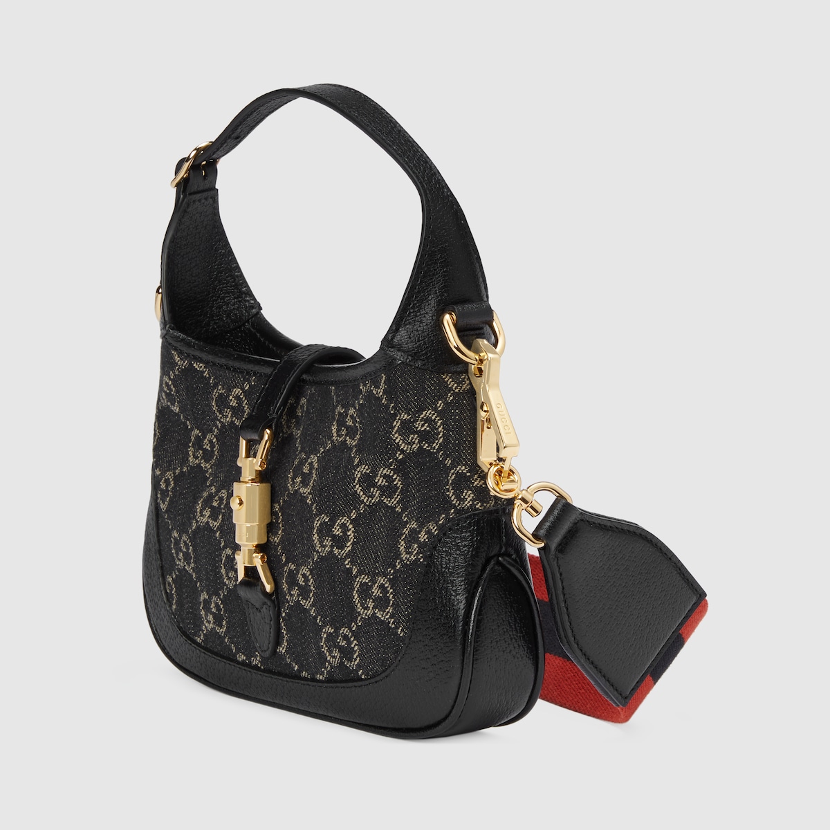 Jackie 1961 mini shoulder bag in black and ivory GG denim