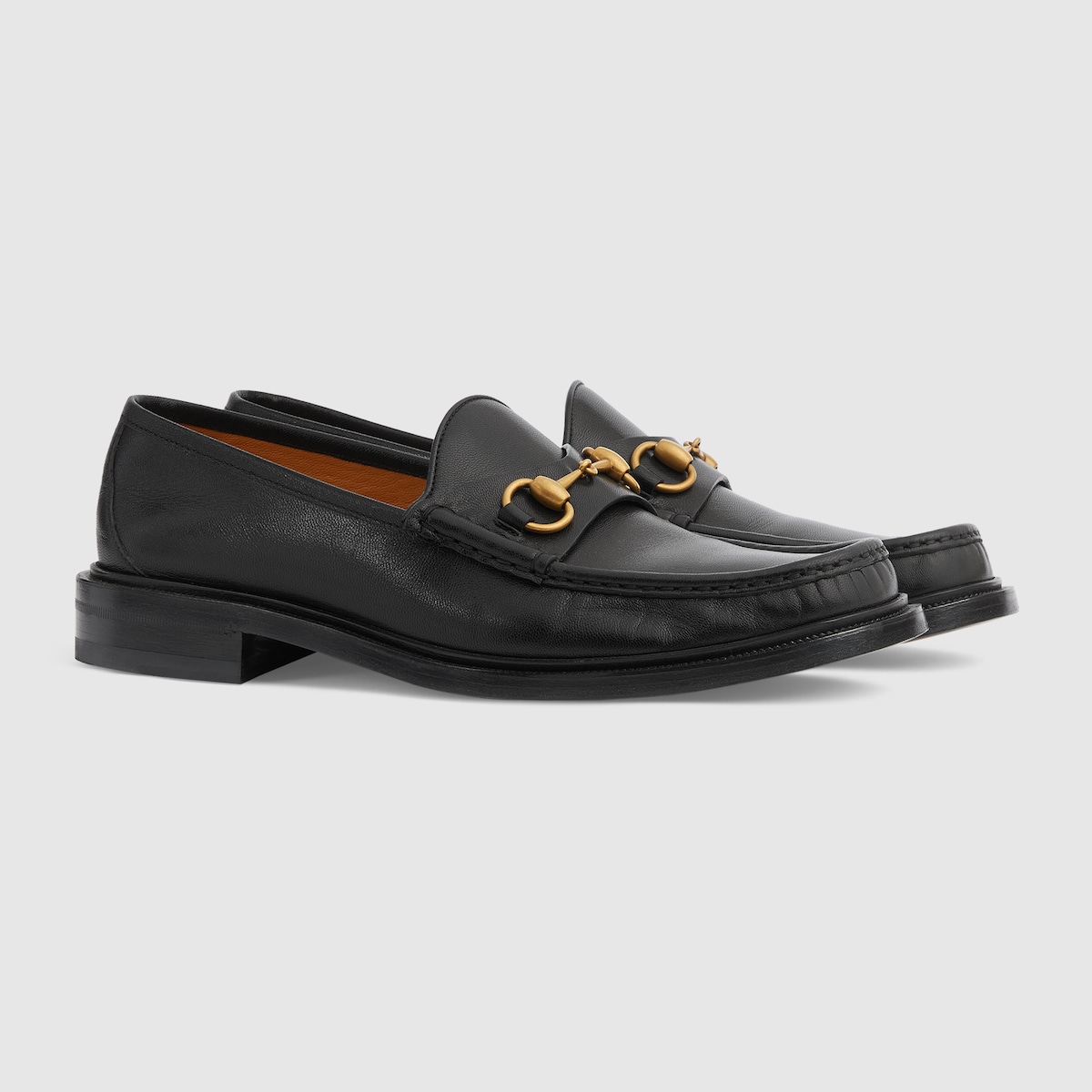 Black and gold gucci hot sale loafers