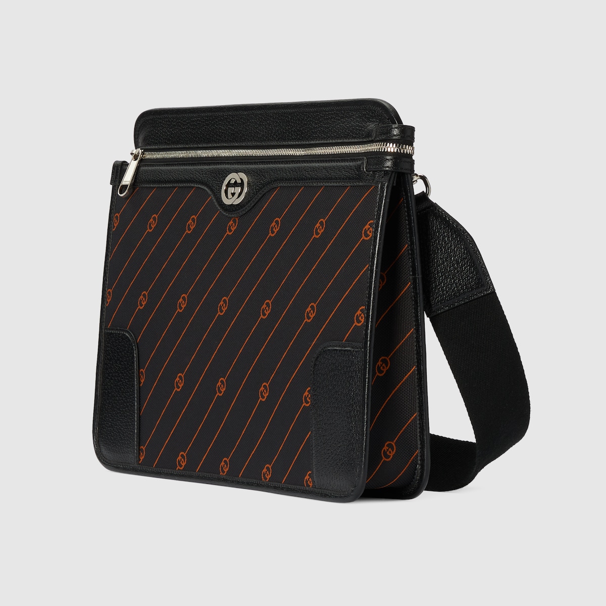 Interlocking medium messenger bag in black and orange fabric