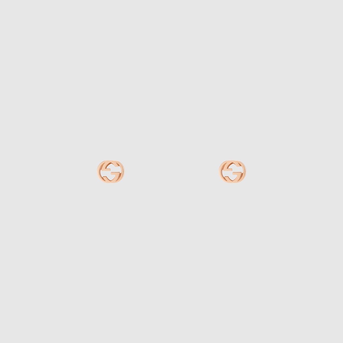 Gucci Interlocking stud earrings in 18k rose gold | GUCCI® CA