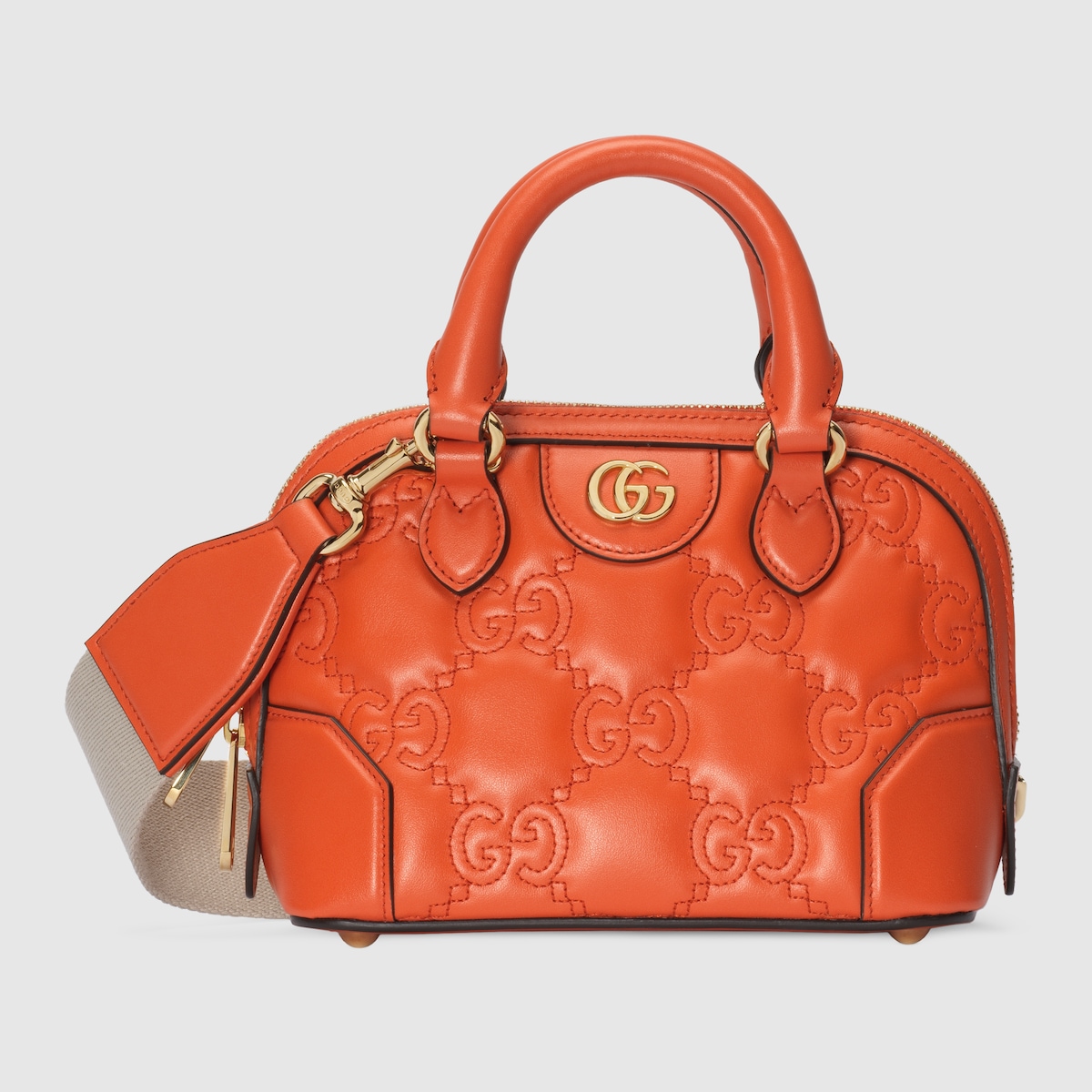 GG Matelassé mini top handle bag in orange leather | GUCCI® SG