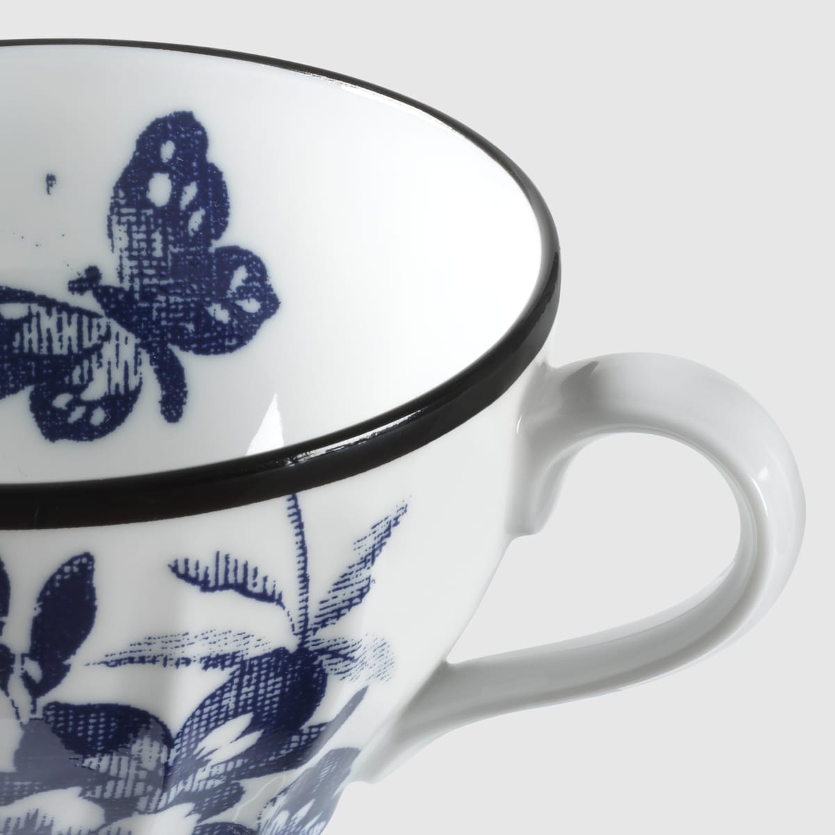 Herbarium teacup and saucer, set of two in blue and white porcelain