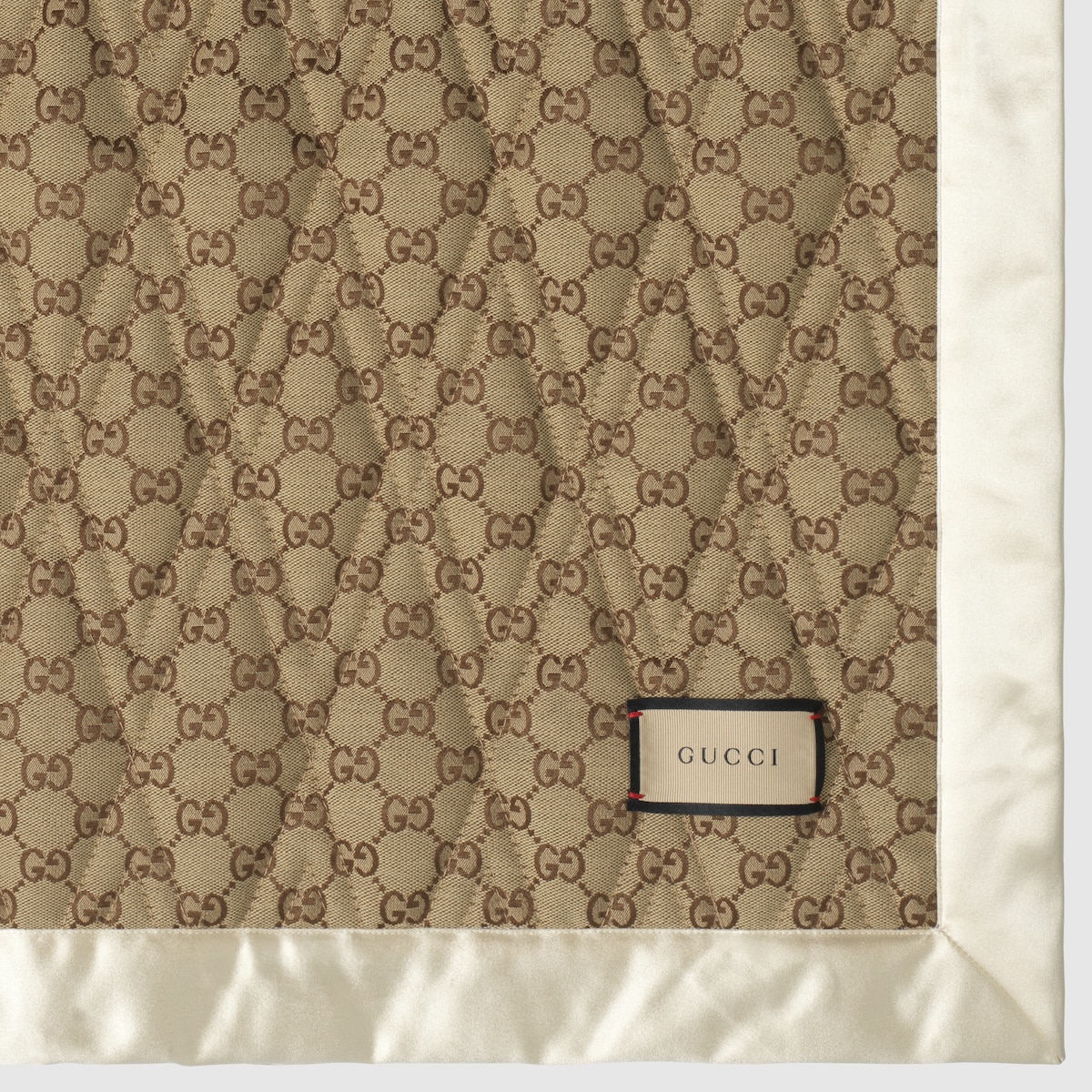 Double-sided GG quilted cotton blanket in dark beige and ivory