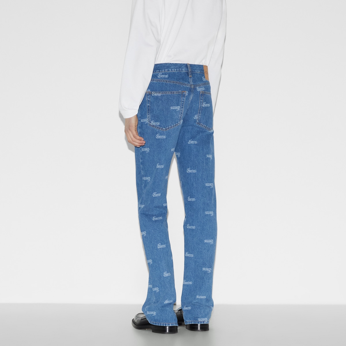 Denim pant with lasered Gucci detail in blue | GUCCI® SG