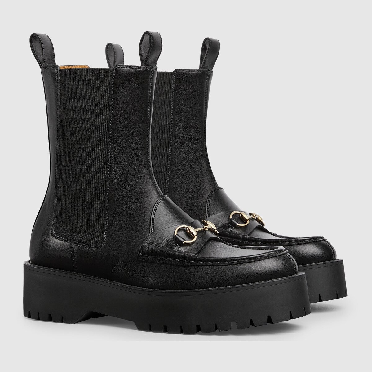 Women s Horsebit boot with lug sole in black leather GUCCI GR