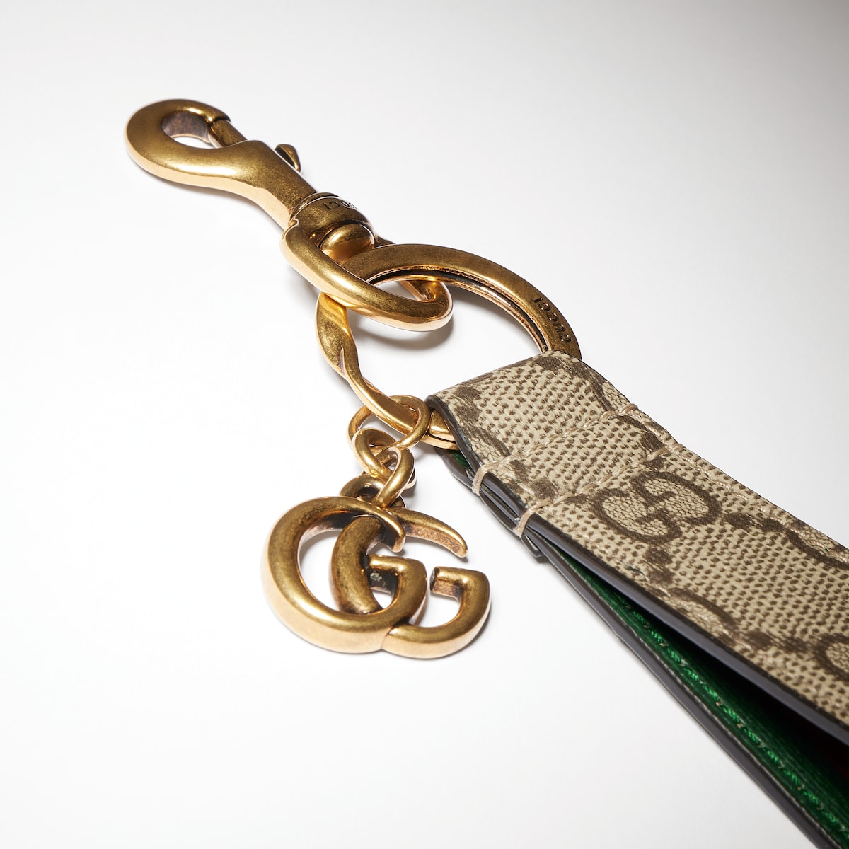 Ophidia keychain in beige and dark brown Supreme canvas | GUCCI® AU