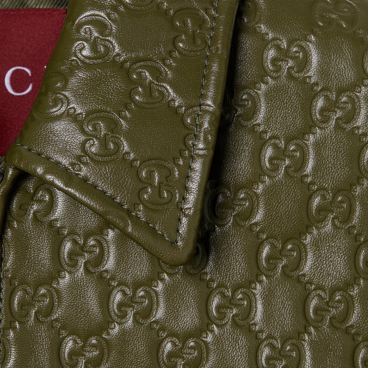 GG embossed leather bomber jacket in dark green | GUCCI® DK