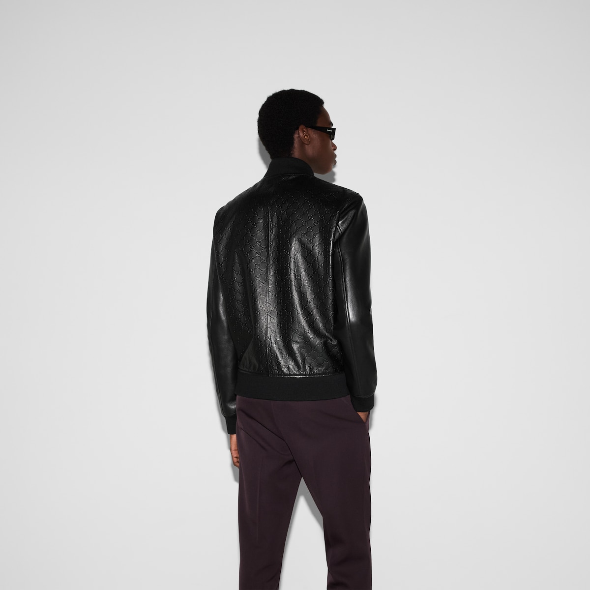 Embossed GG leather bomber jacket in black | GUCCI® UK